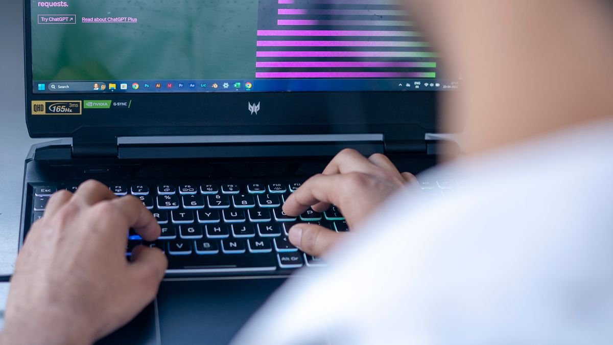 Professional using an AI tool on a laptop while working independently