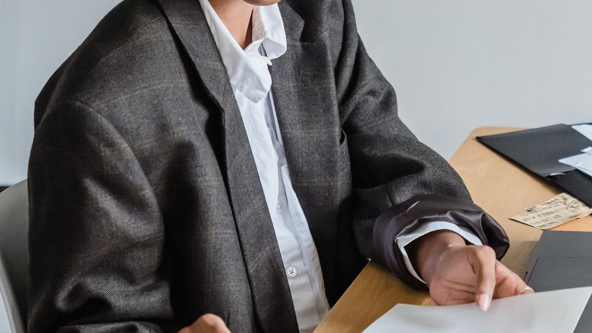 Professional planning and researching career options at an office desk