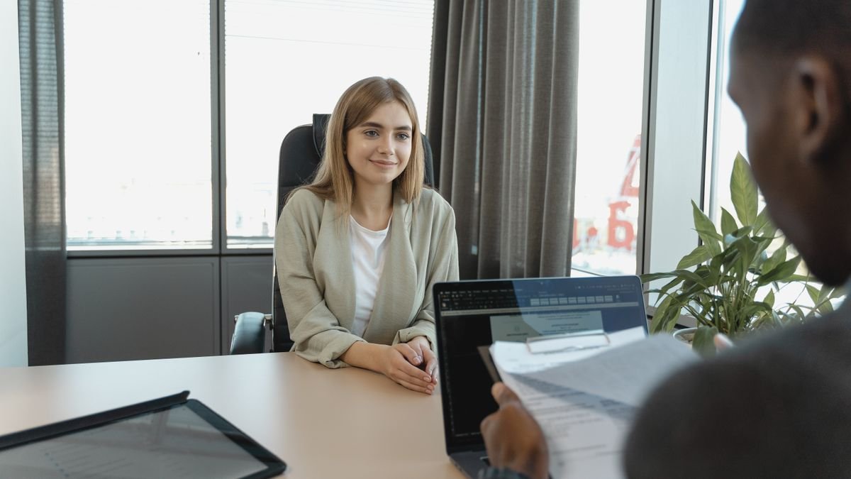 Entry-level candidate sitting in a professional job interview