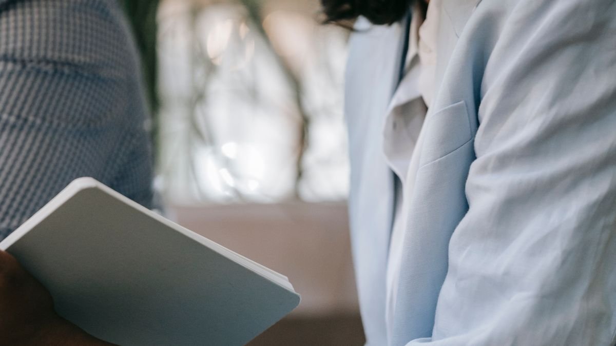 Professional taking notes during a career-focused conversation