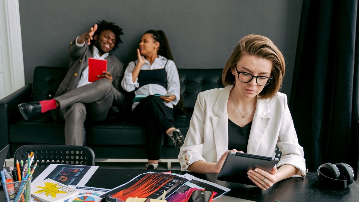 Young professionals collaborating in an office while gaining practical work experience