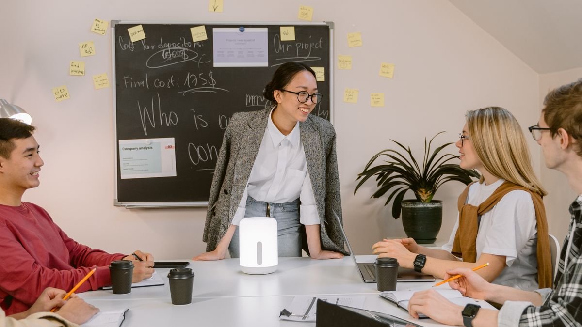 Young professionals working together in an office during an internship-style experience