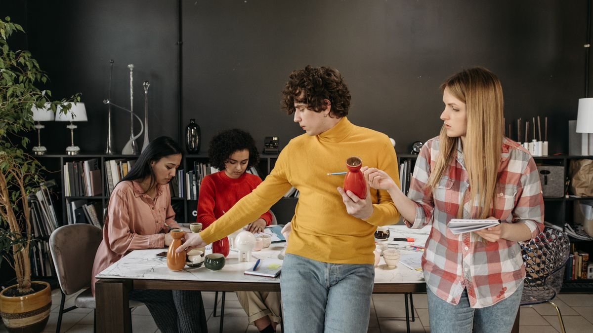 Young professionals collaborating in an office while gaining practical experience