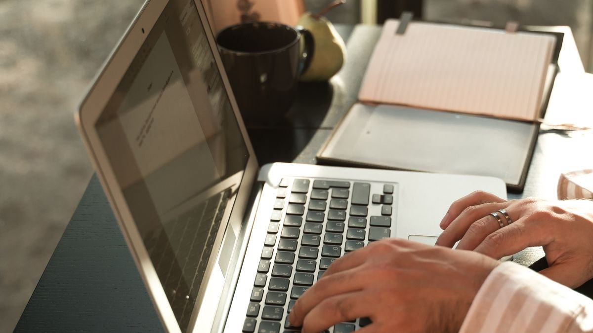 Person writing a professional thank-you email after a job interview