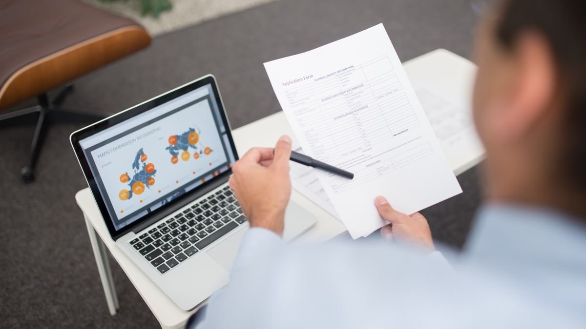 Job seeker reviewing a job description and taking notes