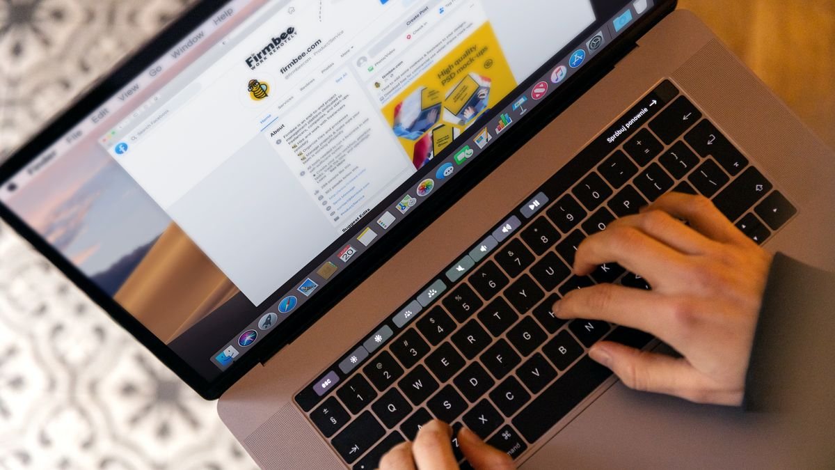 Beginner updating a professional LinkedIn profile on a laptop