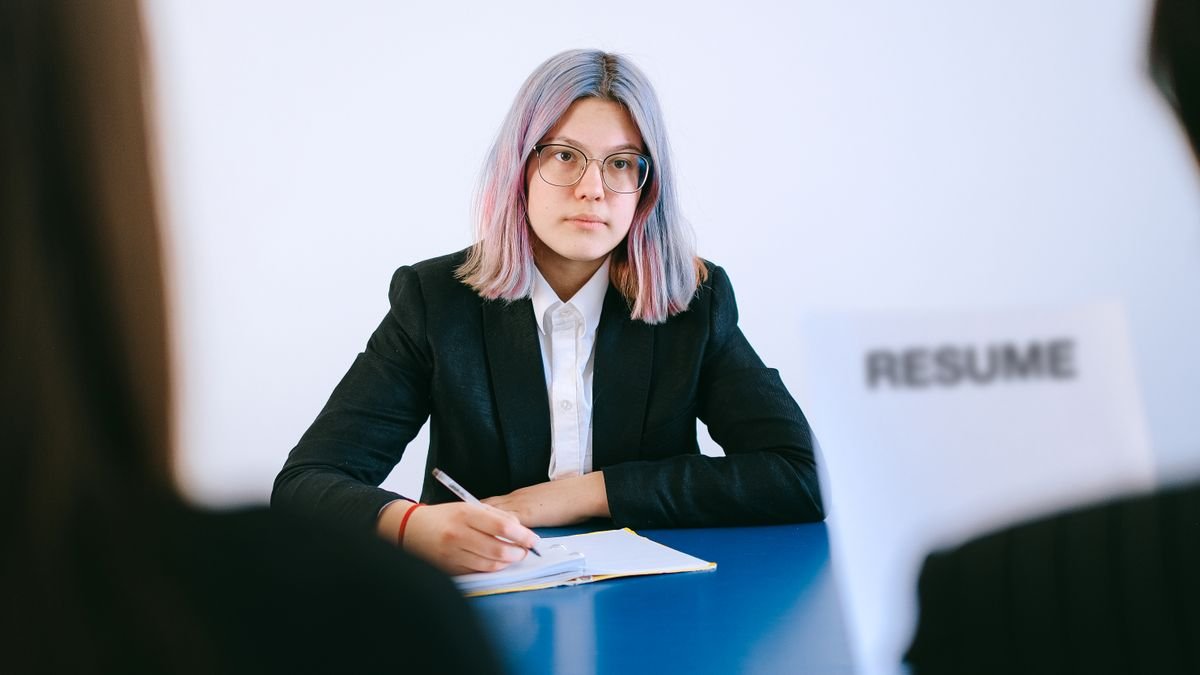 Candidate taking notes during interview preparation