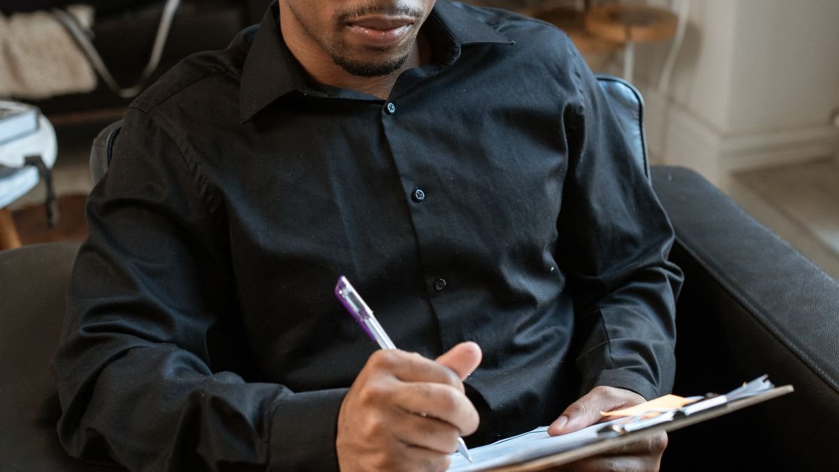 Candidate reviewing notes for a professional interview introduction