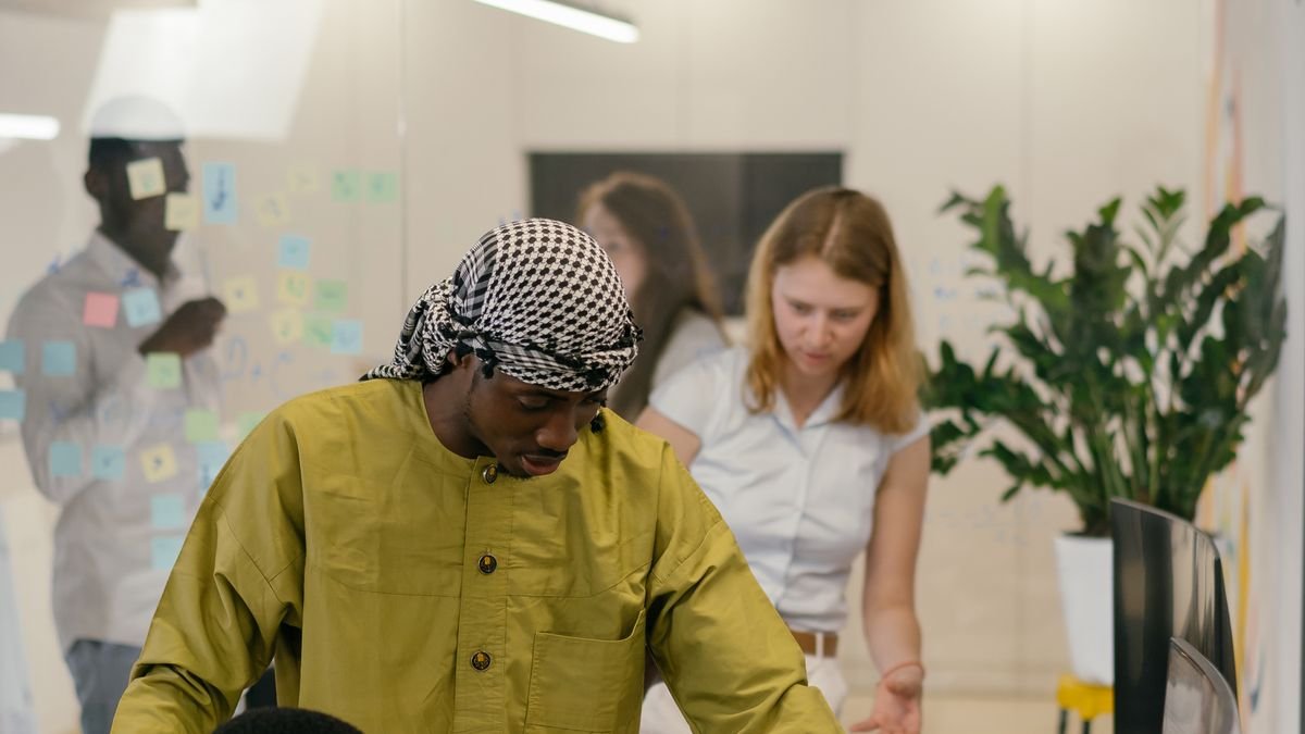 Coworkers having a focused discussion during a collaborative office meeting